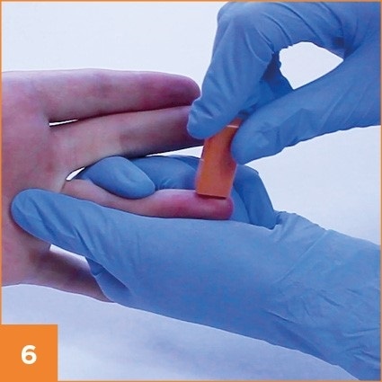 Step 6 in taking a blood prick
