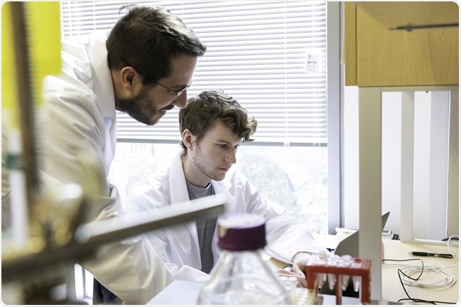 Jason S. McLellan, associate professor of molecular biosciences, left, and graduate student Daniel Wrapp, right, work in theMcLellan Lab at The University of Texas at Austin Monday Feb. 17, 2020.