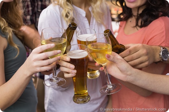 Young friends having a drink together at the bar