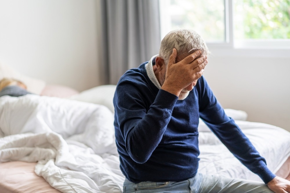Sick unhappy senior elderly man touching head serious depressed feeling headache thinking of problem, alzheimer, cancer, stroke, parkinson, disease and cerebral haemorrage