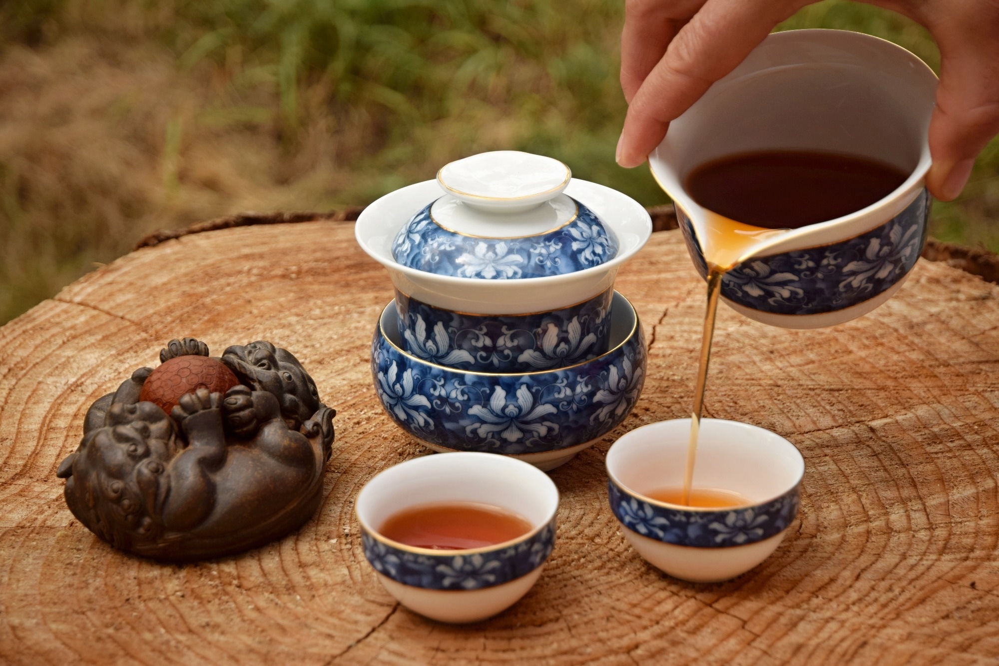 Preparing Liupao tea (black tea) in the tea set on the wooden table